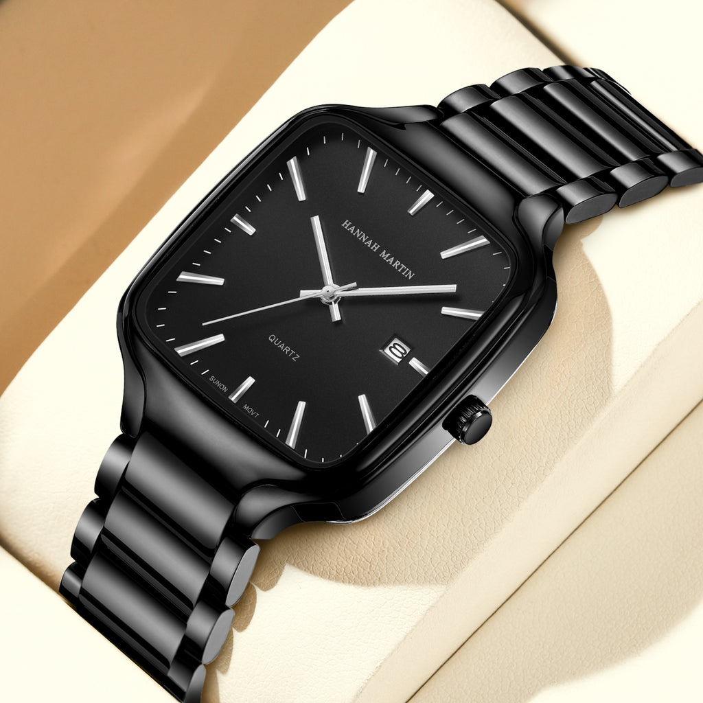 HM1691 black watch with silver-tone hands on a cream display cushion