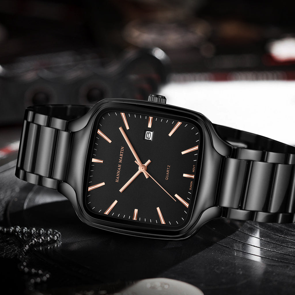 HM1691 black watch with rose-gold-tone hands displayed on a dark textured surface