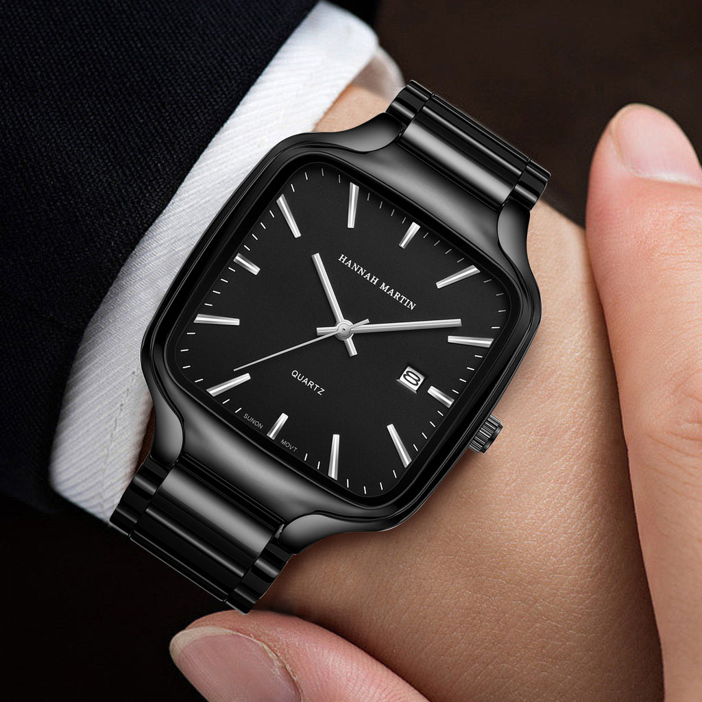HM1691 black watch with silver-tone hands worn with a dark suit and white shirt