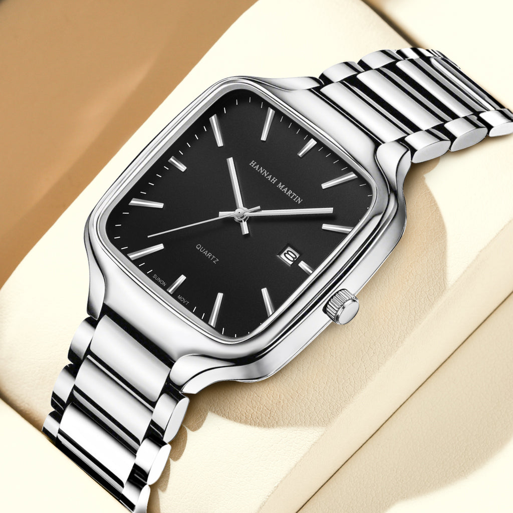 HM1691 silver-tone watch with black dial on a cream display cushion