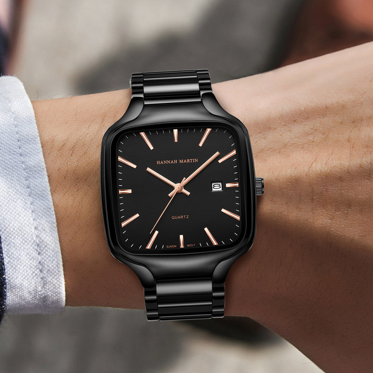 Front wrist view of HM1691 black watch with rose-gold-tone hands